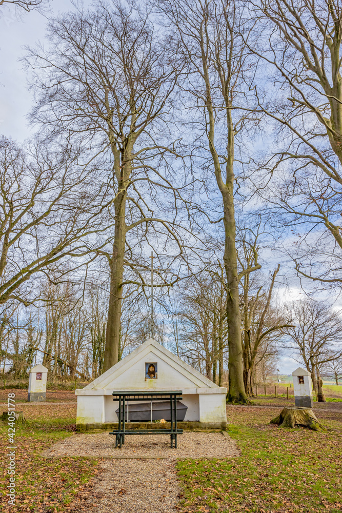 Central shrine and the Stations of the Cross surrounded by bare trees. Way of the Cross in the Hermitage at Schaelsberg (De Kluis) in Valkenburg aan de Geul in South Limburg, Netherlands