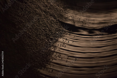 Iron pellets (granules) production in rotating drum machine. Motion blurred. Rudny, Kostanay region, Kazakhstan. Sokolovo-Sarbay mining and processing plant. photo