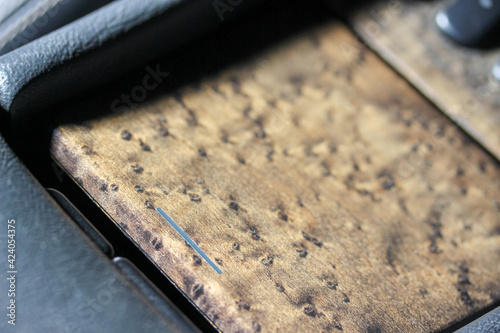 Close up of a car dashboard wood trim