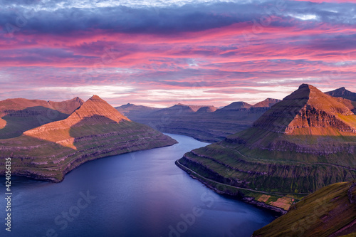 Incredible purple sunset over majestic fjords of Funningur, Eysturoy island, Faroe Islands. Landscape photography photo