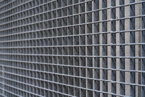 Gray metal lattice fence. Abstract gray background.