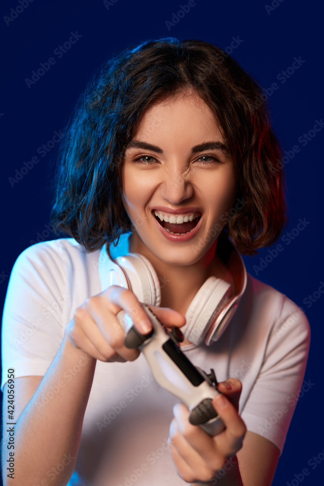 happy curly involved gamer girl playing video games happy curly involved gamer girl playing video games