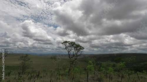 Time lapse of clouds passing over the mountains in the field -4k