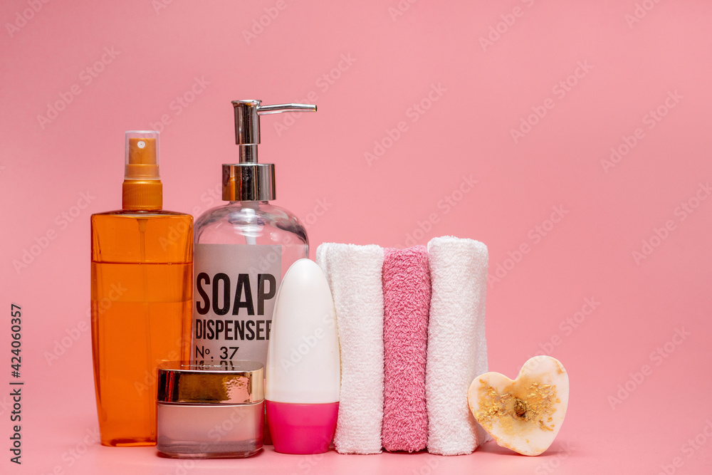 Cosmetic bottles with cosmetics for body care. Acessories for bath, towel and organic dry shampoo for personal hygiene. Daily bodycare concept, organic bath products.