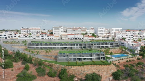 Wallpaper Mural Albufeira, Portugal. Aerial view over the residential block in seaside town. Whitewashed houses and parking lots on steep slopes. High quality 4k footage Torontodigital.ca