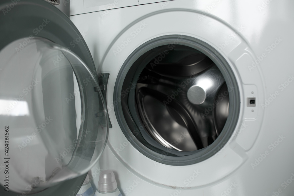 Opened empty washing machine. Opened empty washing machine.