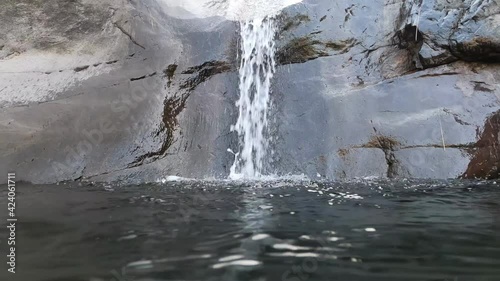 water flowing into the water. Waterfall.