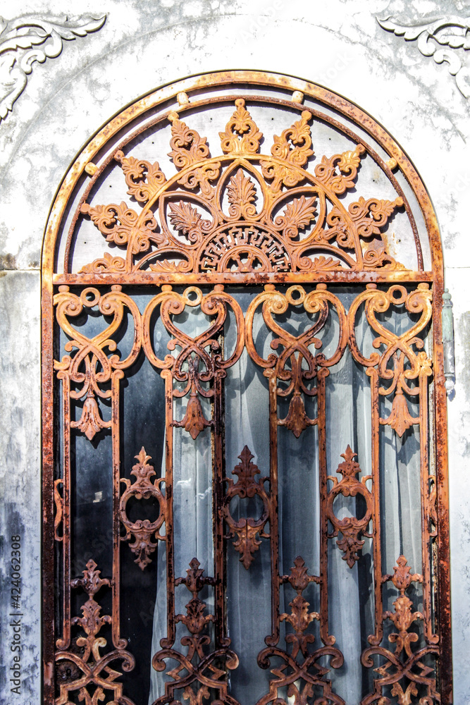 Wrought iron door in cemetery