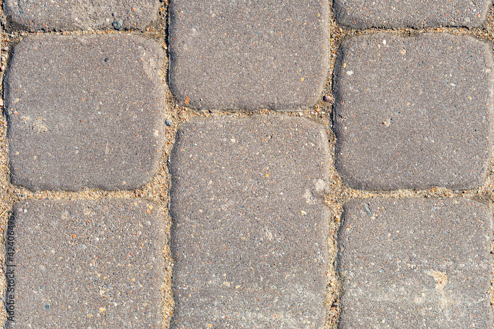 Obraz premium Paving slabs close up, texture of concrete paving stone, stone background