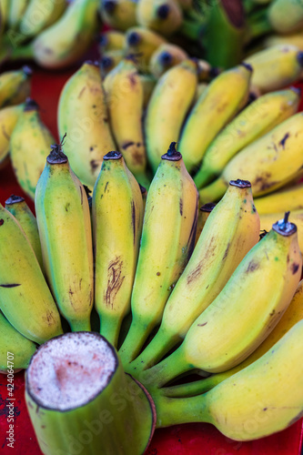 Bunch of ripe Bananas in a street market in Bangkok, Thailand. Vertical