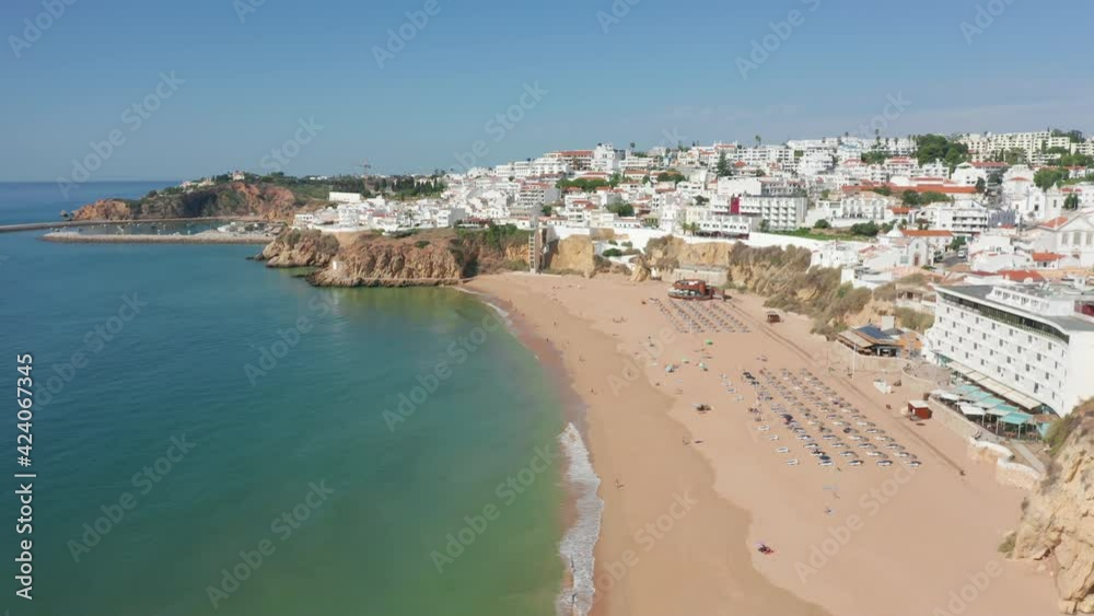 Albufeira, Portugal. Aerial vista of beautiful seaside resort. Wonderful coastal architecture, sandy beach and turquoise ocean waters as seen from the top. High quality 4k footage Albufeira, Portugal. Aerial vista of beautiful seaside resort. Wonderful coastal architecture, sandy beach and turquoise ocean waters as seen from the top. High quality 4k footage