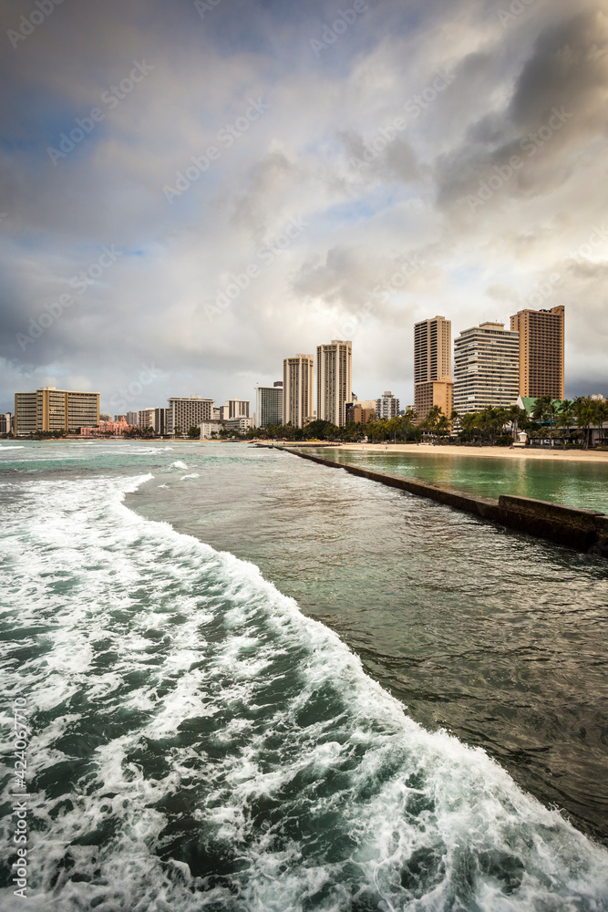 Kuhio Beach Park in Waikiki with a view of the hotels,
