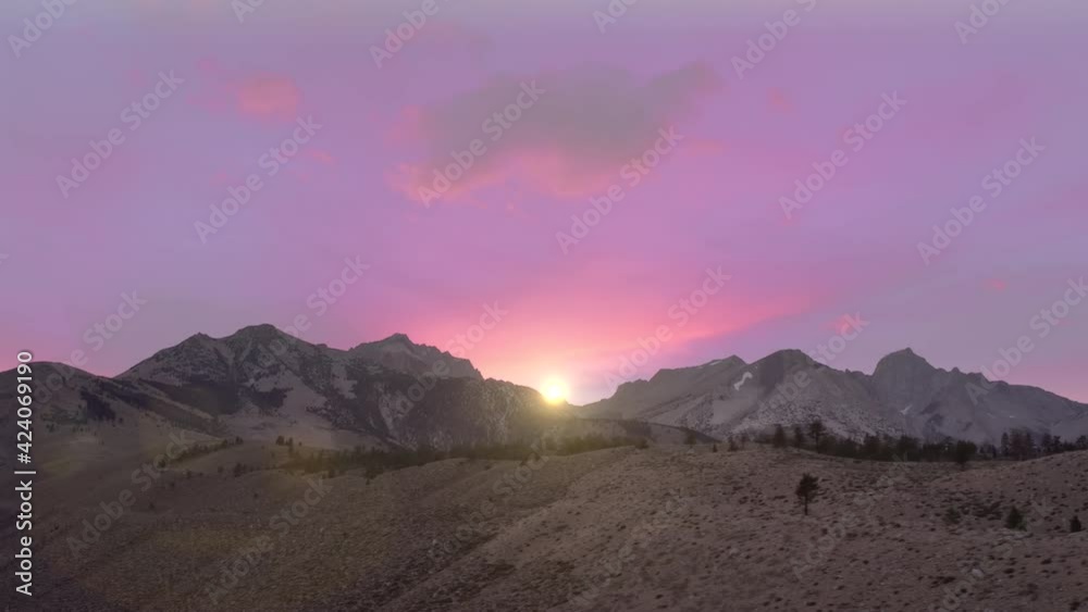 Beautiful pink and purple sky at sunset. Mountains aerial. High peaks covered by snow, cinematic view Sierra Nevada Mountains. Scenic landscape view at sunrise. Outdoor travel adventure video, 4K USA Beautiful pink and purple sky at sunset. Mountains aerial. High peaks covered by snow, cinematic view Sierra Nevada Mountains. Scenic landscape view at sunrise. Outdoor travel adventure video, 4K USA