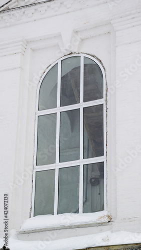 window in a white brick wall