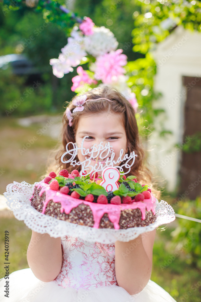 girl holding birthday cake with number 8 and inscription girl holding birthday cake with number 8 and inscription
