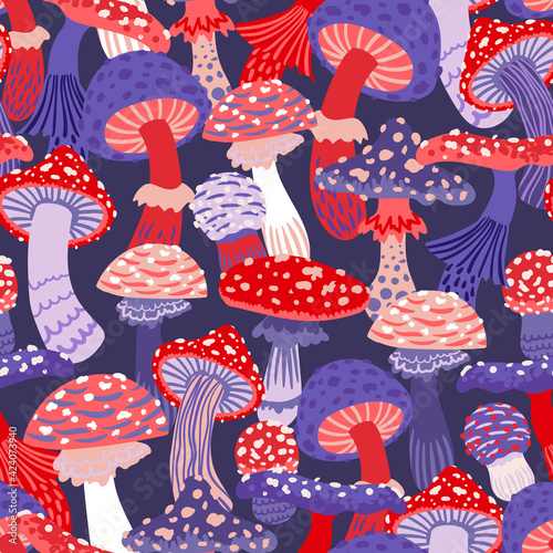 Seamless vector pattern of stylized mushrooms in red-purple colors