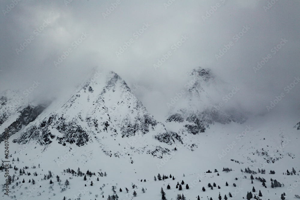 Top of snow capped mountains during the winter time Top of snow capped mountains during the winter time