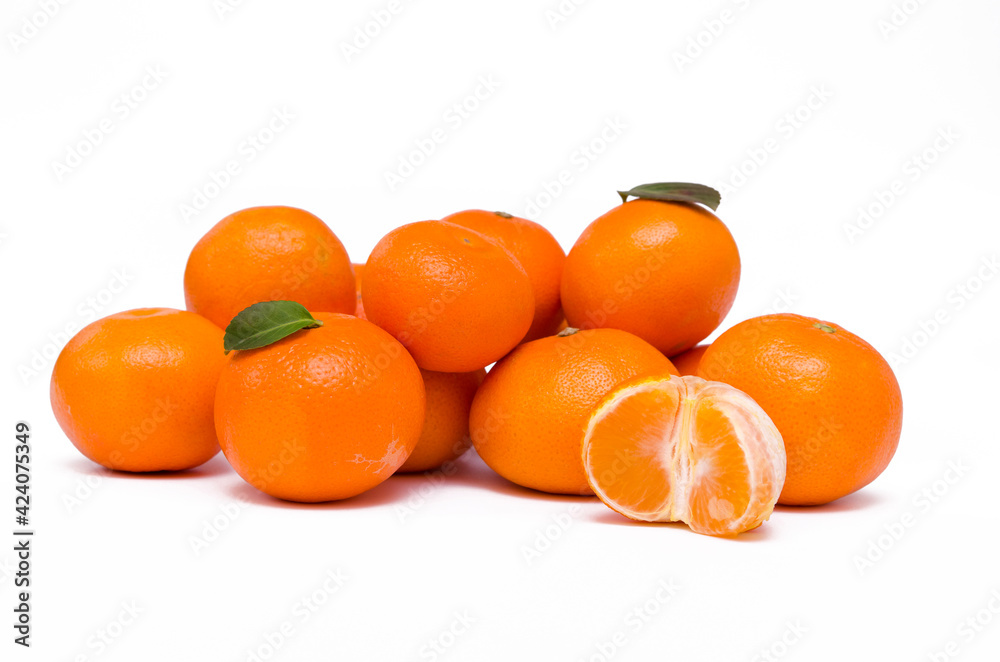 ripe whole tangerines and half fruit on a white background isolated ripe whole tangerines and half fruit on a white background isolated