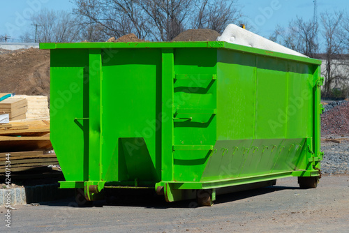 big green dumpster recycle big dirty garbage photo