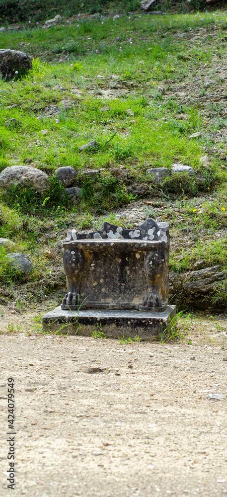 The theatre of the Amphiareion oropos Greece,Marble thrones with relief floral decoration The theatre of the Amphiareion oropos Greece,Marble thrones with relief floral decoration