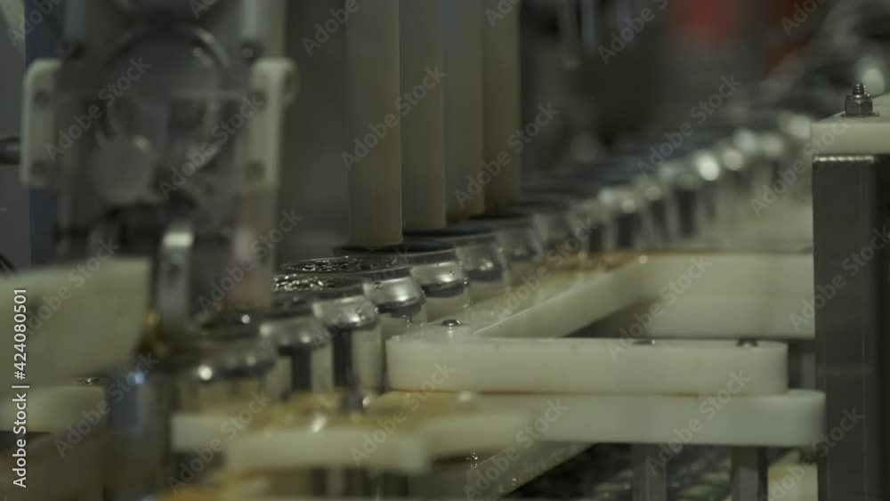 Craft Beer Cans Being Filled On A Microbrewery Canning Line Craft Beer Cans Being Filled On A Microbrewery Canning Line