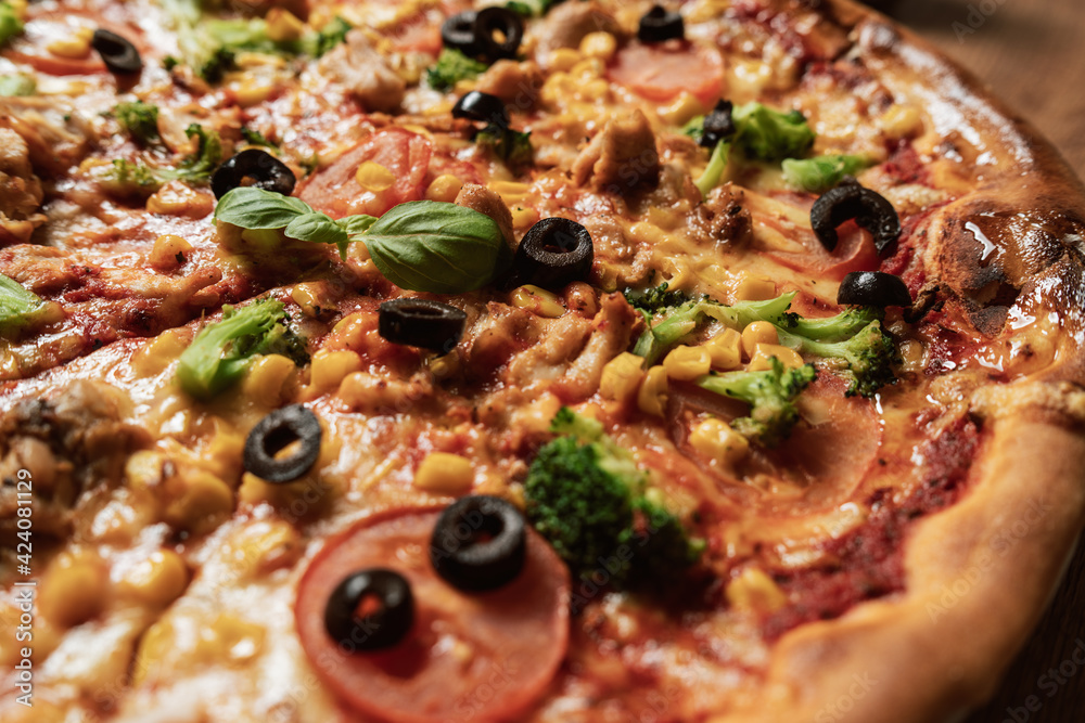 Close-up of an italian pizza with ingredients. Selective focus Close-up of an italian pizza with ingredients. Selective focus