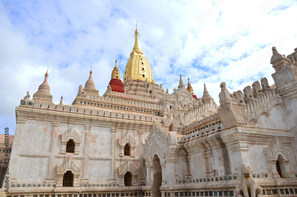 A corner of Ananda pagoda's exterior under the sunlight of a cloudy day in Bagan, Myanmar
