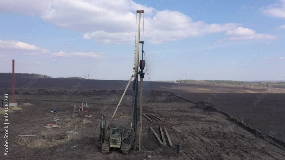 Excavation at a construction site, diesel pile driving machine with ...
