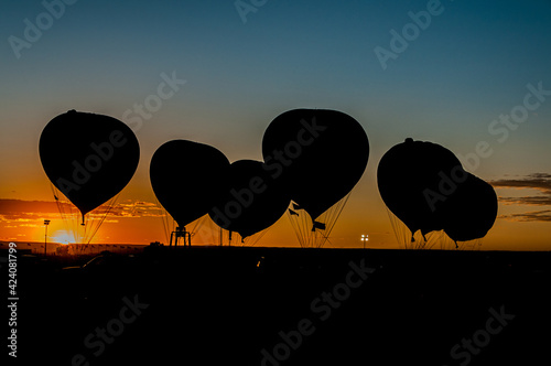 Silhouette of Gas Balloons at Sunset photo