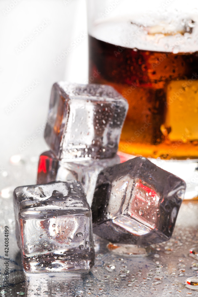 Glass of whiskey with ice Glass of whiskey with ice