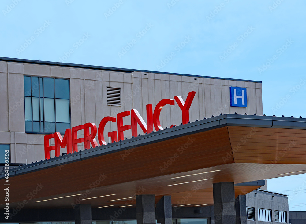 Emergency sign above entrance to hospital emergency department