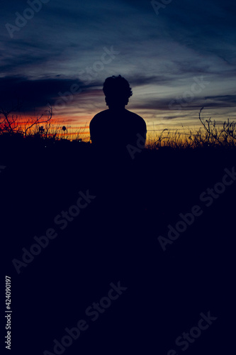 silhouette of  young  person in sunset © Elmer Hidalgo Photo