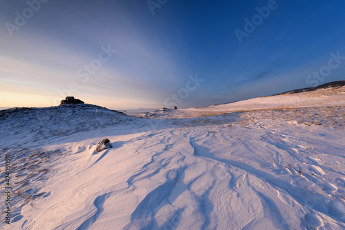 View above big beautiful frozen lake and mountain in winter, Baikal lake, Russia