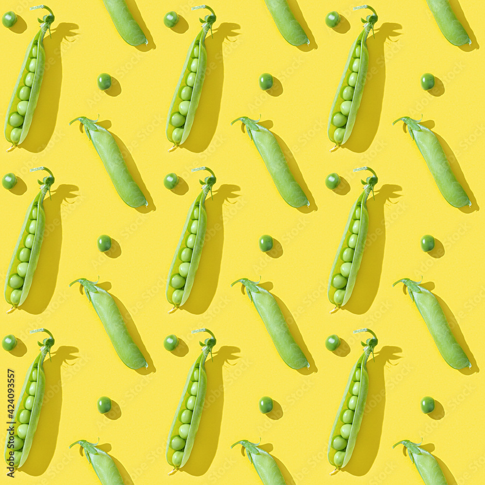 Fresh sweet green peas and opened pod pea, healthy vegetable food on bright yellow background Fresh sweet green peas and opened pod pea, healthy vegetable food on bright yellow background