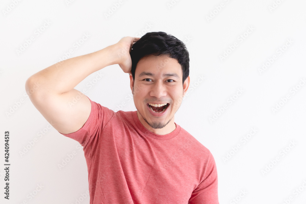 Enjoy and laughing face of Asian man in red t-shirt on isolated background. Enjoy and laughing face of Asian man in red t-shirt on isolated background.