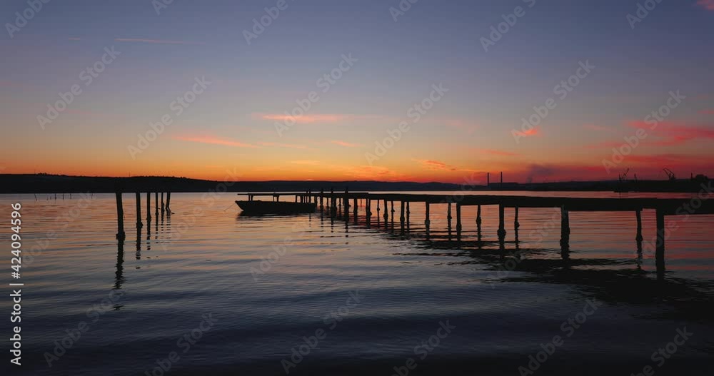 Small dock and fishing boat on sunset, long exposure hdr, 4k video Small dock and fishing boat on sunset, long exposure hdr, 4k video