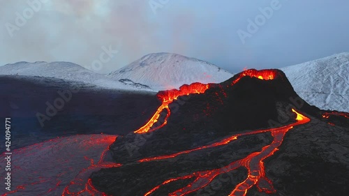 Aerial footage of the eruption in Fagradalsfjall in southern Iceland in 2021, shot in winter with snow on the ground
