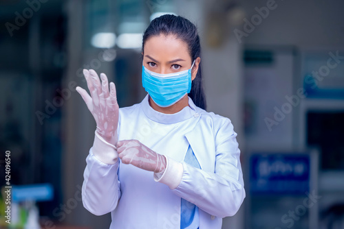 Doctor or nurses showing how to wearing face mask and Medical gloves.