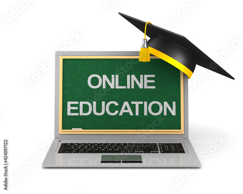 laptop and graduation cap o...