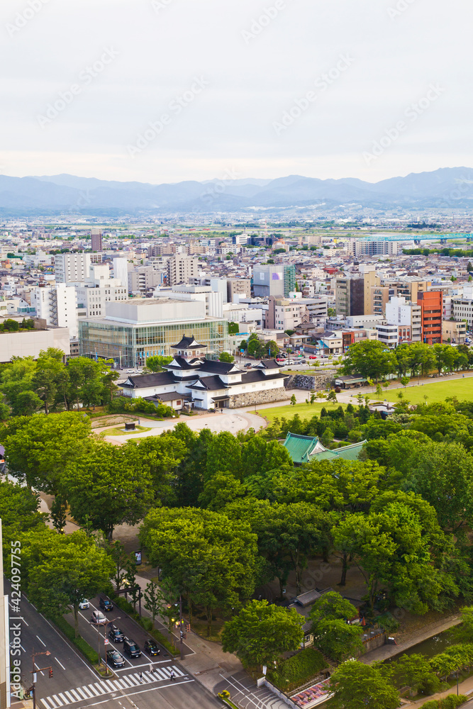 Toyama cityscape and Tetayama mountain range (Japan alps) views from Kasui park in Toyama city, Toyama, Japan. Toyama cityscape and Tetayama mountain range (Japan alps) views from Kasui park in Toyama city, Toyama, Japan.