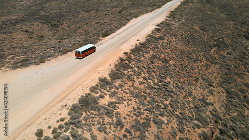 Aerial - School bus on desert road near Exmouth, Western Australia