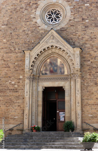 The entrance to the ancient basilica. Tuscany, Italy