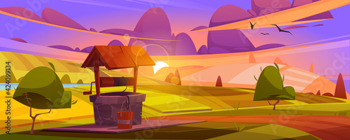 Old stone well with drinking water on green hill. Summer morning or evening landscape with vintage rural well with wooden roof, pulley and bucket on rope, farm or village Cartoon vector illustration