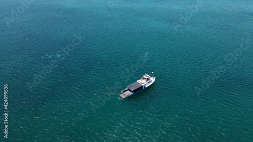 Fishing boat in turquoise water sea aerial shot © Santiago
