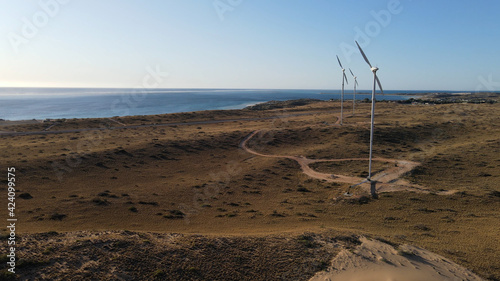 Wind turbines at sunset aerial shot renewable energy