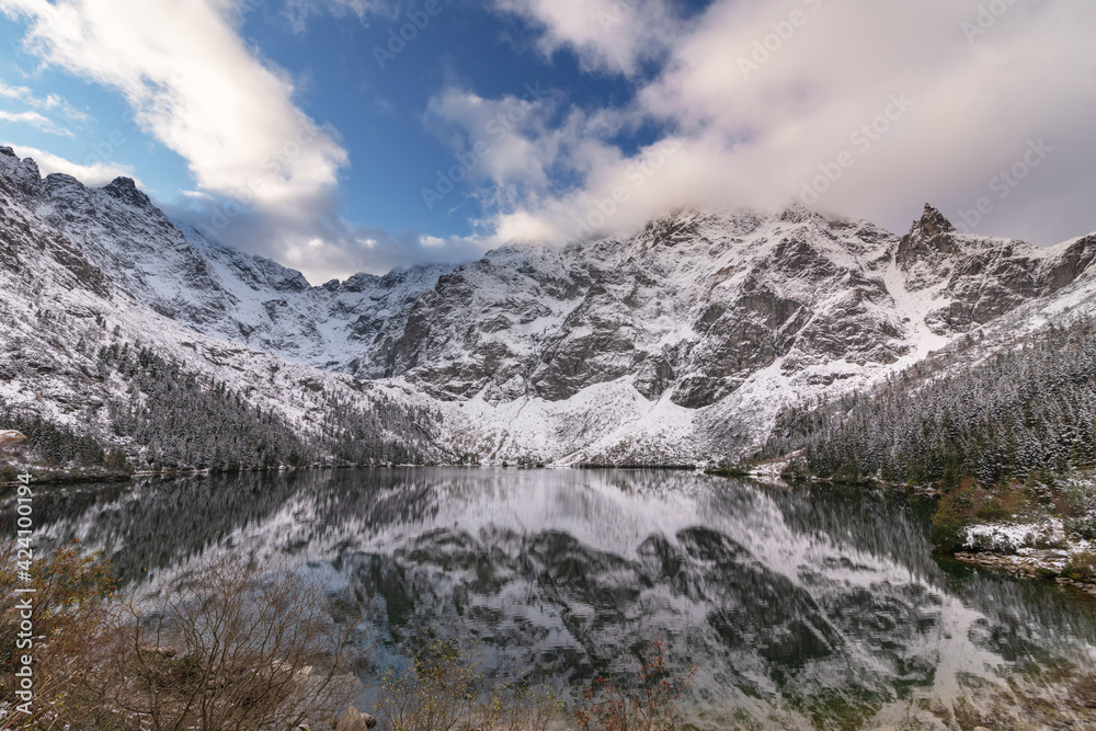 Beautiful views of the Polish High Tatras with mountain lakes and picturesque houses in the summer season