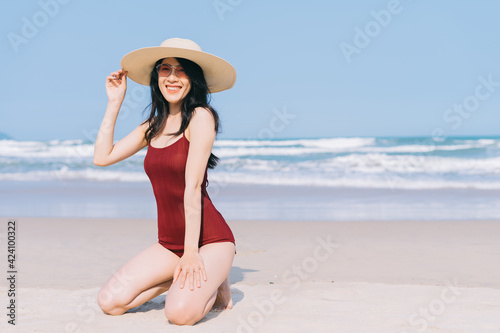 Wallpaper Mural Beautiful young asian woman in swimwear relaxing at the beach during summer vacation Torontodigital.ca