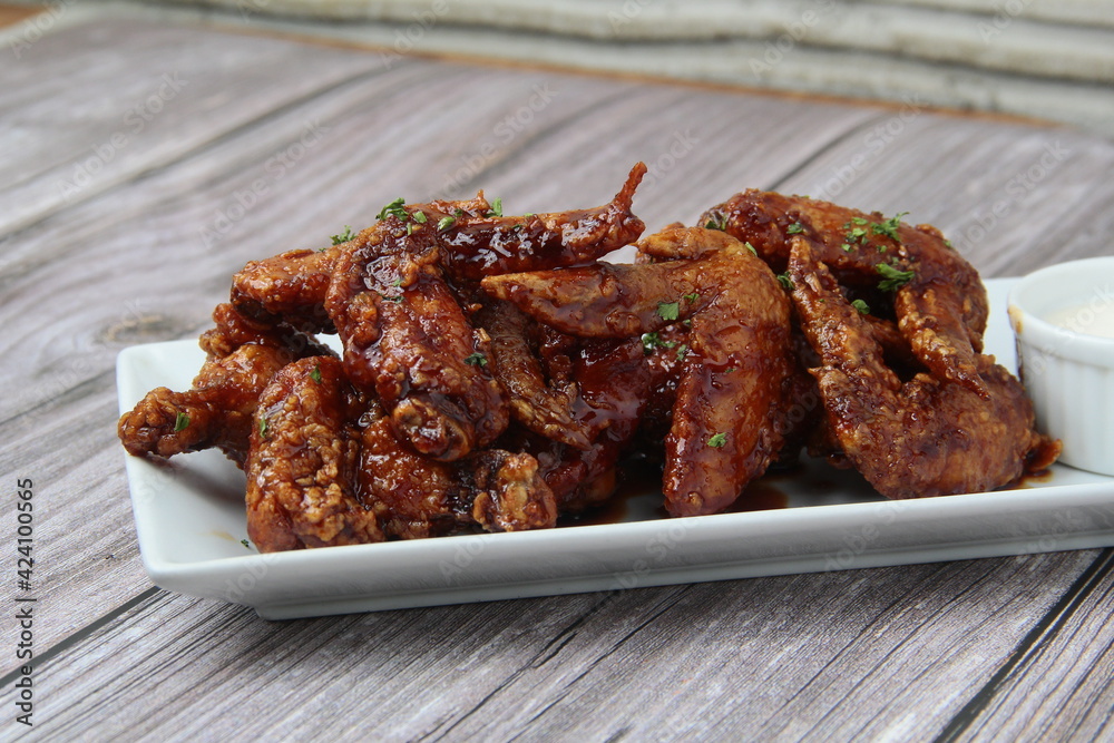 Freshly cooked flavored chicken wings Freshly cooked flavored chicken wings