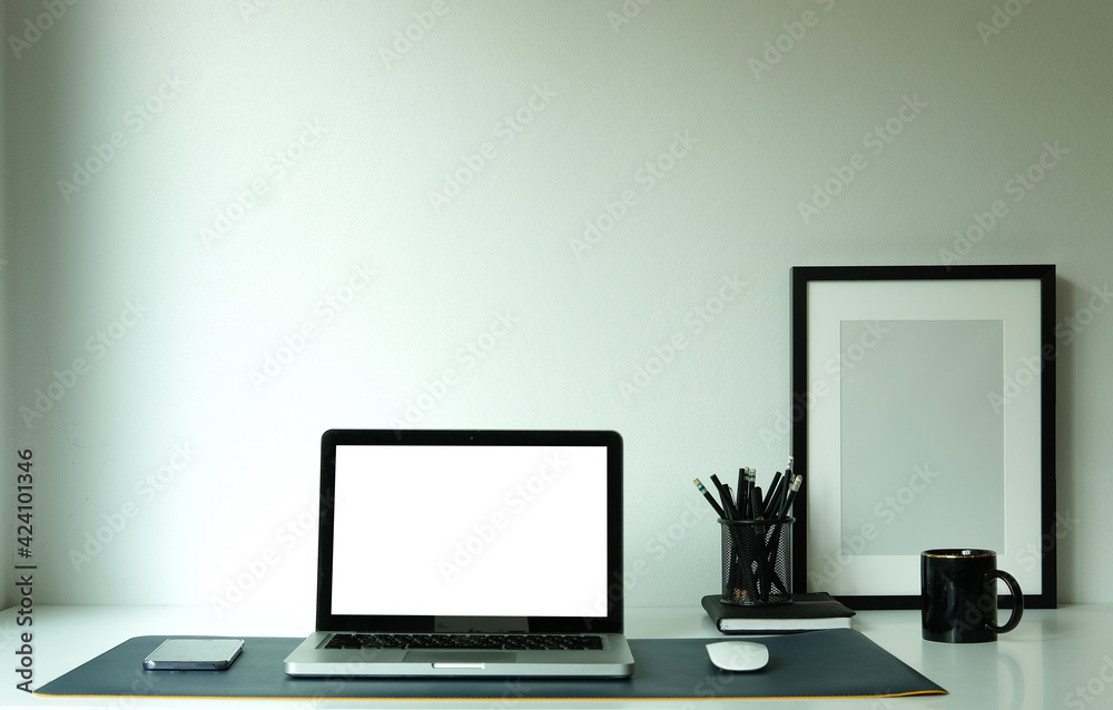 Computer with empty screen on white table at female workplace. Computer with empty screen on white table at female workplace.