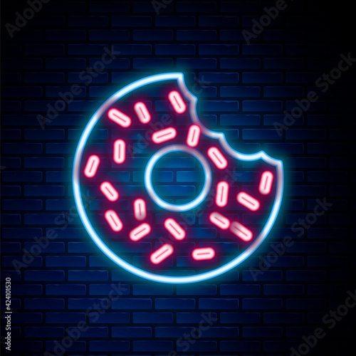 Glowing neon line Donut with sweet glaze icon isolated on brick wall background. Colorful outline concept. Vector